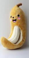 A banana shaped pillow with a face on it photo