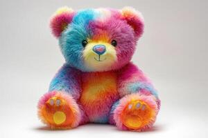 A cute colorful teddy bear sitting on a white background photo