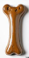 A chocolate dog bone shaped like a letter i photo