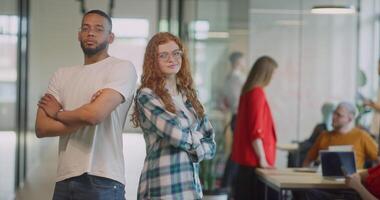 Team of confident businesswomen striding through the hallways of a modern startup space, showcasing their self-assured determination with crossed arms as they convey their dedication to work video