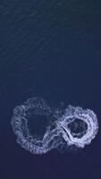 Powerboat turns loop number eight on the sea making infinity future concept video