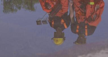 A group of prepared firefighters stands ready for hazardous tasks involving rescuing victims and extinguishing fires, exemplifying their dedication and bravery in the face of emergencies video