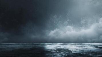 A moody seascape under a stormy sky depicting turbulent ocean waters meeting a dramatic cloudscape creating a sense of impending weather photo