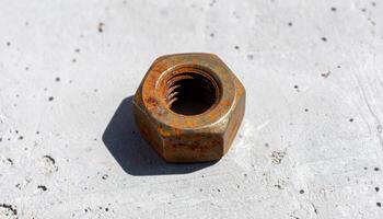 Rusted Hex Nut On Concrete photo