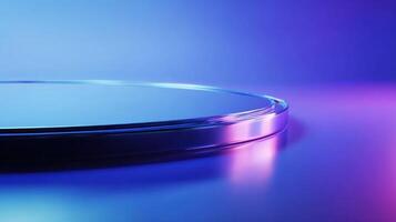 Sleek round platform with a glossy metallic rim illuminated by vibrant blue and pink lighting A product display surface photo