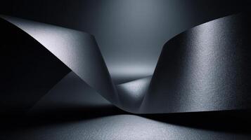 Abstract monochrome image featuring flowing dark paper in a minimalist composition showcasing light and shadow interplay photo