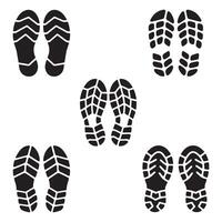 Shoe Print Icon Set. Footprint Silhouettes and Boot on a white background vector