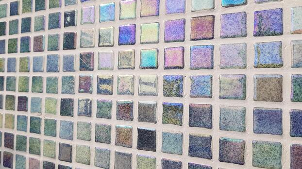 Prismatic mosaic tiles displaying rainbow spectrum and refracted light effect with vivid color transitions creating a vibrant atmosphere in spatial design photo