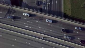This is an Aerial View showcasing the Urban Traffic as it flows along an Open Highway. Stock Clip video