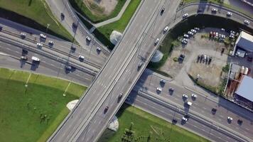 A Captivating Aerial View of a Busy Urban Traffic Interchange and Its Surroundings. Stock Clip video