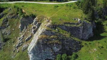 A Magnificent Aerial View of a Rocky Cliff Surrounded by Beautiful and Lush Greenery. Clip video