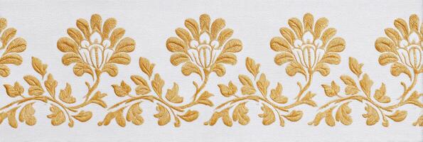 Jaal pattern featuring intricate floral designs in golden hues on a white background, showcasing elegant craftsmanship and traditional artistry in textile design photo