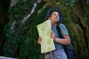 Adventurous Female Hiker Exploring Nature with a Map photo