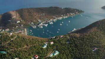 Reversing, tilting up from Soper's Hole with sailboats and Tortola island hillside video