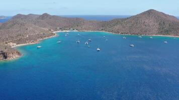 Aerial view, approaching cove with catamarans of Norman Island, BVI video