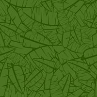 Seamless pattern with tropical leaves on a green background. vector