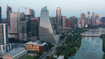 Flying Parallel to a Busy Downtown City Road with an Amazing Up-Close View of the Austin Buildings at Sunset video