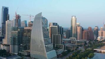 Golden Hour in Downtown Austin - Flying Slowly in Reverse, Away From the Sailboat Building and Revealing the Expansive Cityscape video