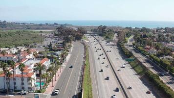 Aerial drone view of San Clemente California's coastal I-5 freeway and ocean video