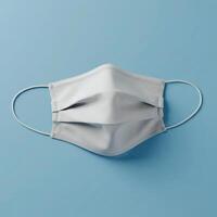 White Medical Face Mask Mockup on Blue Background photo