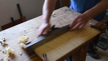 Luthier working in a new violin or viola video