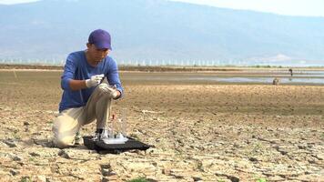 asian scientist keeping an water and soil sample to find solutions of environment deterioration problems. video