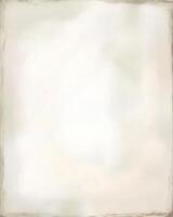 Grungy light beige paper or canvas background with worn edges and a subtle distressed look photo