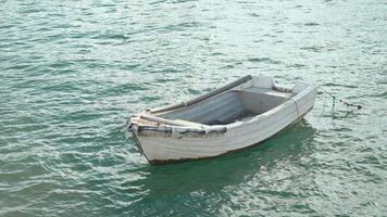 Boat Floats Quietly in Serene Waters Near Coastal Landscape video