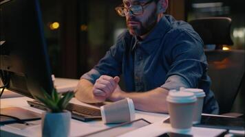 Caucasian guy sleeping tired businessman sleep nap at dark night office lost health problem insomnia overtime male business man workaholic overworked exhausted awake stressed typing computer deadline video