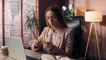Caucasian business woman girl female businesswoman office worker shrugging shoulders confusion using laptop pc entering password credit card data denial error failure transaction don't know indoors video