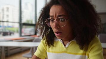 African American girl student using laptop studying online businesswoman holding head failure lost upset bad news reading error fail computer in university ethnic business woman female problem learn video