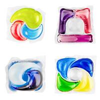 set liquid detergent in capsules for washing clothes isolated on white background photo