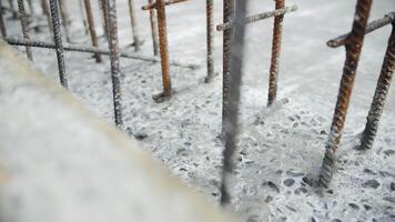 Reinforcement bars set in hardened concrete foundation video