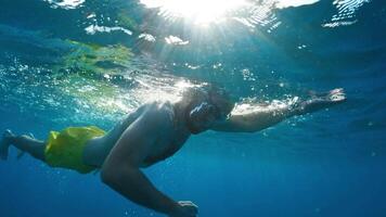Swimmer Doing Cardio Training In the Ocean With Sunlight Hitting The Water video