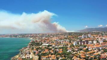 Smoke rising from fire in Sintra, Portugal, aerial view from Estoril video