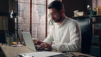 Pensive thoughtful Caucasian manager worker employee male agent man working laptop businessman contemplate guy searching idea decision in office entrepreneur job online tech salesman think difficulty video