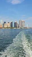 Skyline of Manhattan View from the Ferry, A panoramic view of Manhattan's skyline with iconic skyscrapers video