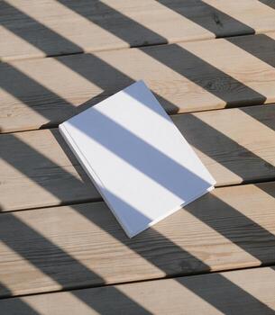 book cover mockup on rustic wooden background with shadow stripes photo