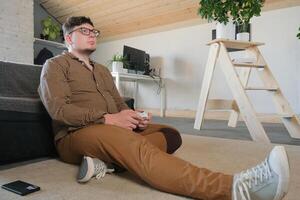 Focused man playing games using controller photo