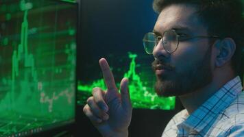 Indian Arabian man programmer businessman business working trader analysing chart strategy male take off glasses unhealthy eyes strain pain headache bad vision tired guy freelancer overworked office video