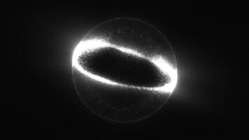 Bright glowing white sphere composed of particles in a dark monochrome environment video