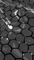 Shiny metallic geometric surface with hexagonal reflective shapes in black and silver tones video
