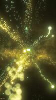 Bright yellow explosion of light with scattered glowing particles on a dark background, resembling an energetic burst video