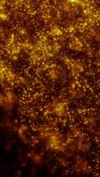 Dense field of glowing golden particles creating a sense of depth and sparkling movement in space video