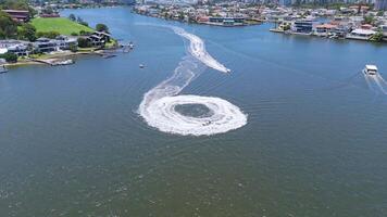 Jet skis creating circular patterns on water video
