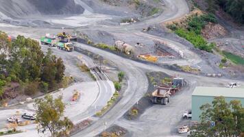 Drone footage captures vehicles and machinery at a quarry in Gold Coast, Australia, highlighting industrial activity and landscape video