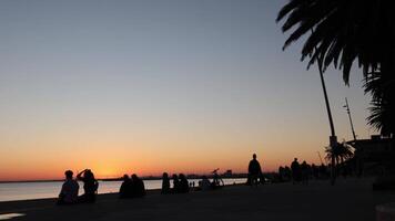 People enjoying sunset at St Kilda Pier video