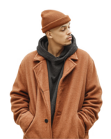Teen boy in rust overcoat with beanie posing in relaxed manner isolated on transparent background png