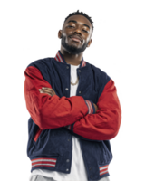 Teen boy in red and blue varsity jacket with folded arms isolated on transparent background png