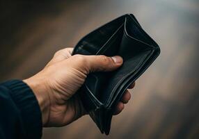Empty wallet in the adult hand, poverty in retirement concept 5 photo